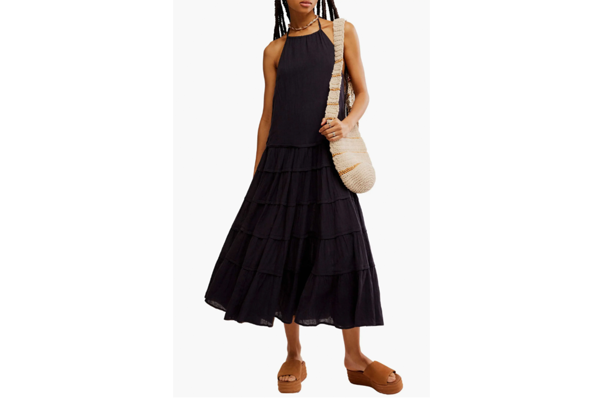 A model in a black sundress