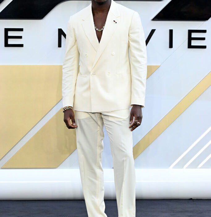 Damson Idris Wore Tommy Hilfiger To The 'F1: The Movie' London Premiere yellow suit