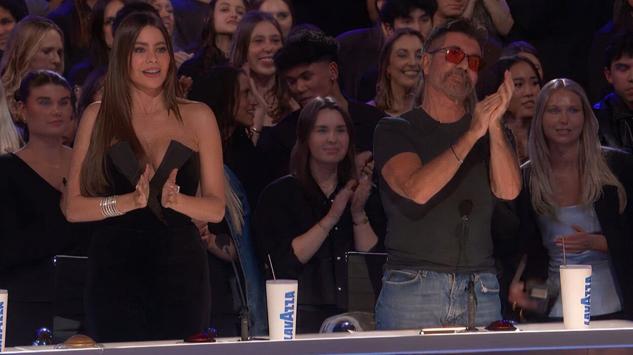 America's Got Talent's Sofia Vergara and Simon Cowell standing and clapping