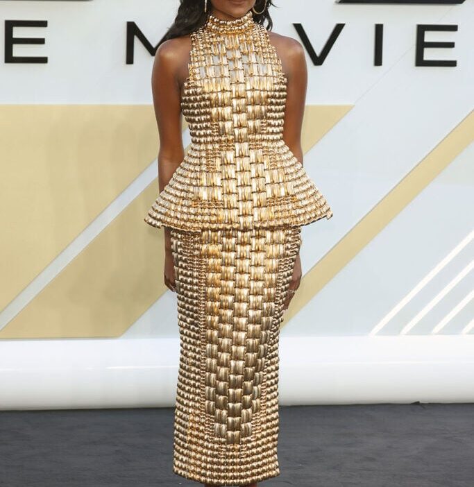 Simone Ashley Wore Balmain To The 'F1: The Movie' London Premiere gold peplum dress.