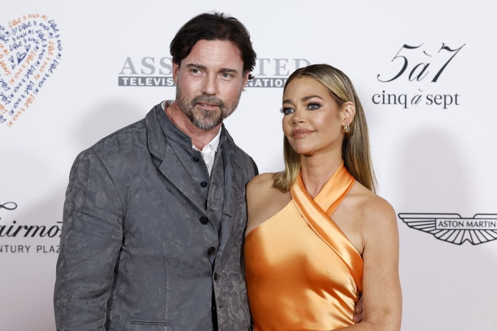 Aaron Phypers and Denise Richards attend the 30th Annual Race To Erase MS Gala at Fairmont Century Plaza on June 02, 2023 in Los Angeles, California.