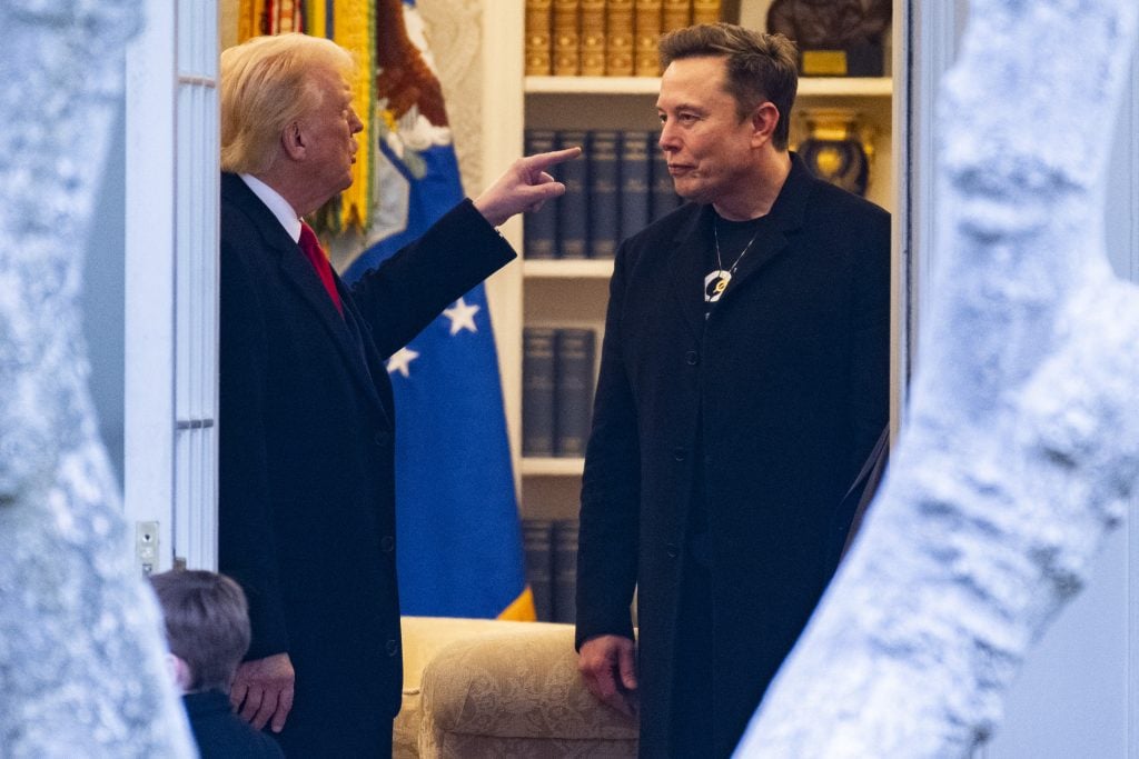Donald Trump and Elon Musk speak before departing the White House on his way to his South Florida home in Mar-a-Lago in Florida on March 14, 2025.