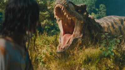 (L to R) Luna Blaise and the T-Rex in 'Jurassic World Rebirth', directed by Gareth Edwards. Photo: Universal Pictures.