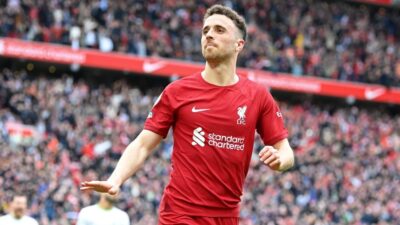 Diogo Jota of Liverpool celebrates after scoring the team's fourth goal during the Premier League match between Liverpool FC and Tottenham Hotspur at Anfield on April 30, 2023 in Liverpool, England.